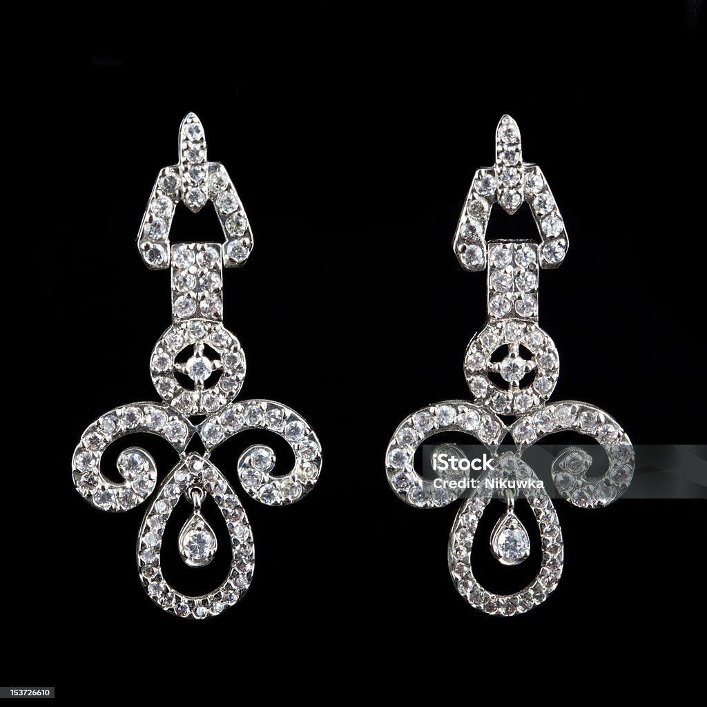 earring with diamond on black Beautiful People Stock Photo