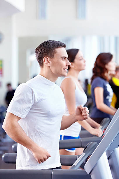 istock Man running on treadmill at gym 153726757