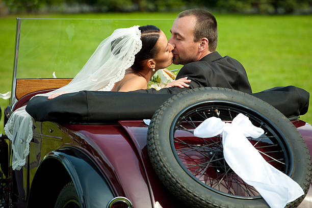 istock wedding couple with olt car 153726813