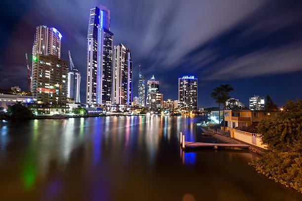 istock Modern city at night with moving clouds 153727056
