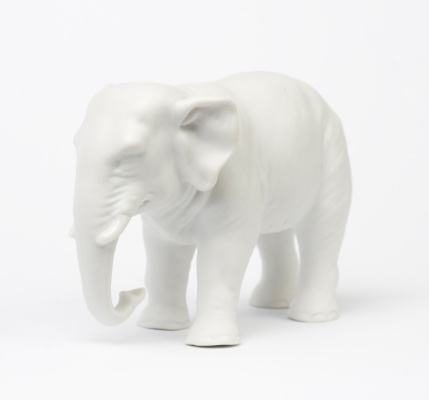 White elephant figure over white background.