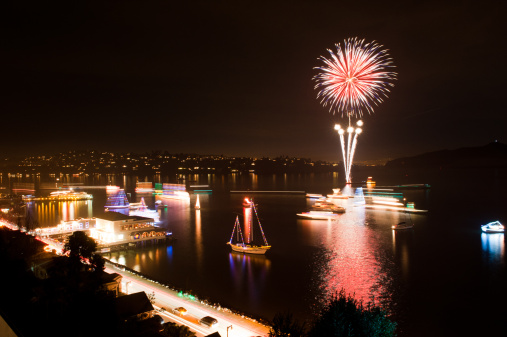 Fireworks show during the Sausalito Christmas Boat Parade.  The boats are all wrapped in christmas lights.