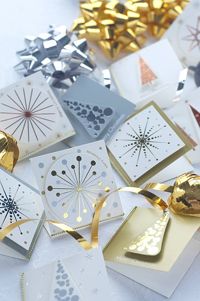 istock Christmas gift tags, ribbons and bows on a white tablecloth 153729051