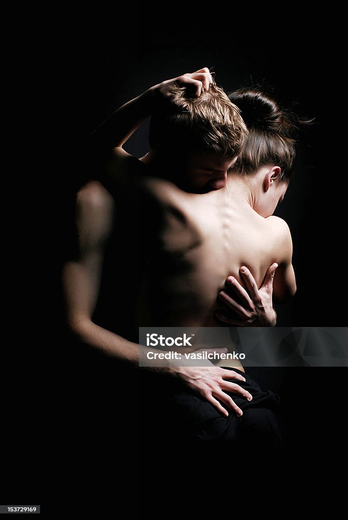 Hugging couple Hugging couple on black background Sensuality Stock Photo