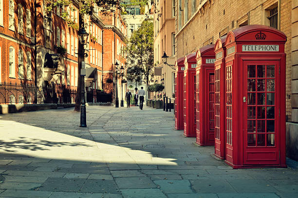 Street in London. Street with a Tradicional Red Phone Boxes near Covent Garden, London covent garden photos stock pictures, royalty-free photos & images