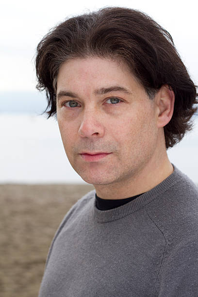 istock Portrait of a man on the beach 153730018