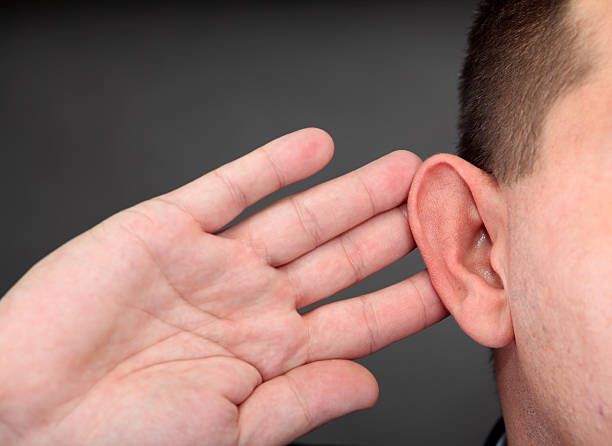istock Man holding his hand to ear saying what? 153730644
