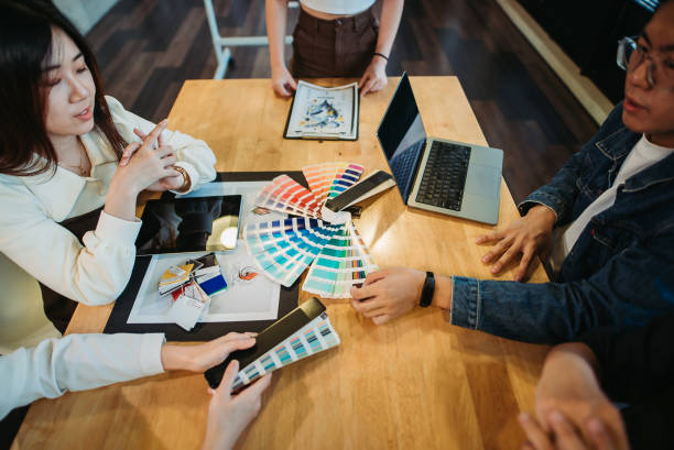 istock Group of graphic designers working together in their workplace 1537308069