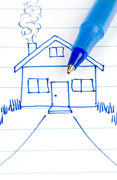 Sketch of a home with pen. stock photo