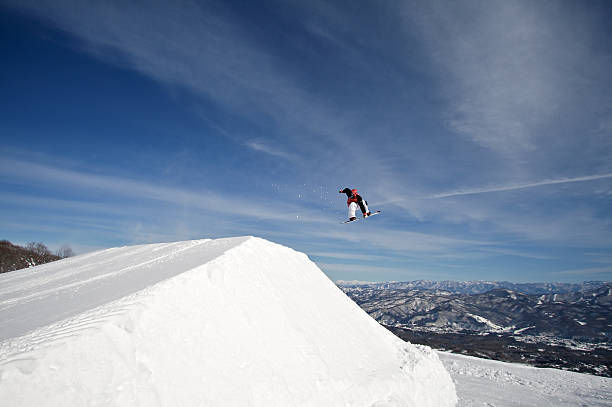 Snowboarder at winter mountain resort stock photo