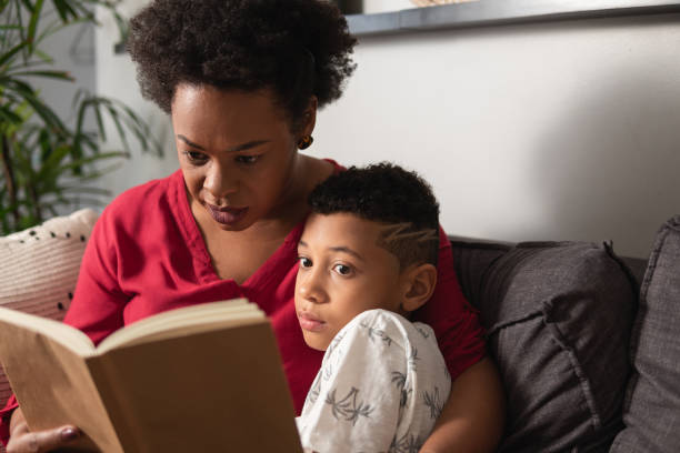 istock mother reading book to son 1537314832