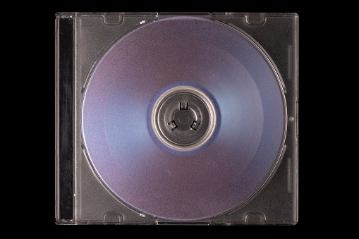 CD box isolated on black background.