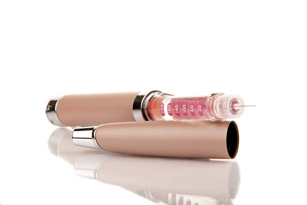 Insulin syringe injector pen with opened needle and i flask inside for diabetes patient on a white background