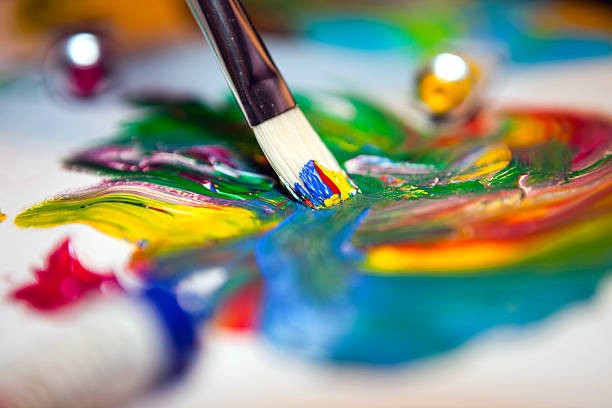 istock Paintbrush with mixed acrylic paint on paper 153733987