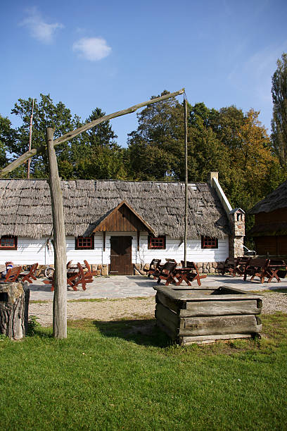 istock cottage and well, Poland 153734075
