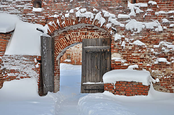 Lviv, Ukraine - December 8, 2021:  Ancient village house in Klymentii Sheptytskyi Museum of Folk Architecture and Rural Life in Lviv (Shevchenkivskyi Hai). Skansen in winter