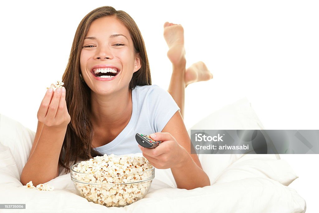 Woman watching funny movie laughing Woman watching funny movie laughing. Isolated on white background. Click for more: Watching TV Stock Photo