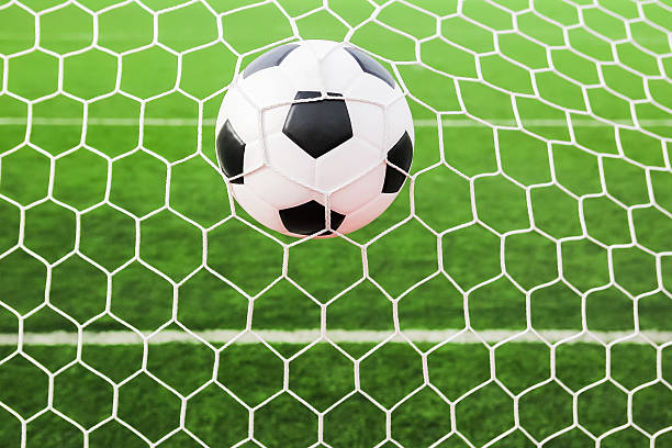 istock soccer ball in the goal net 153735553
