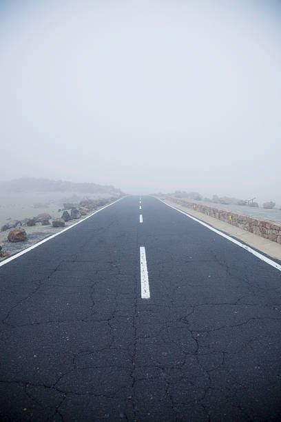 istock road and fog 153735622