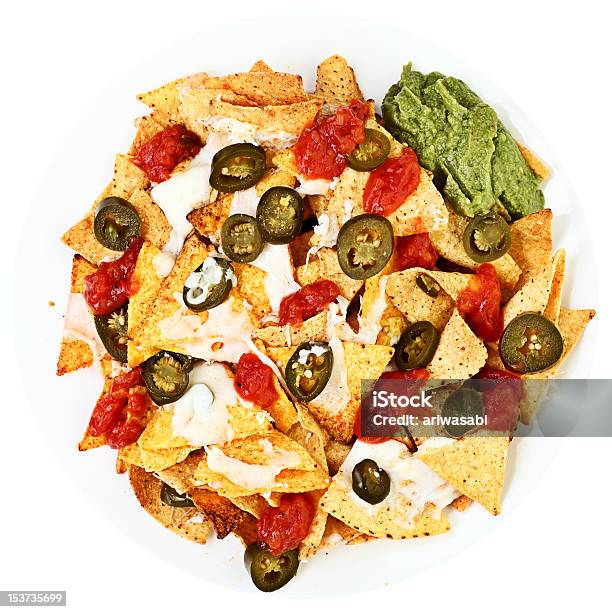 Nachos Covered In Cheese Jalapee Stock Photo - Download Image Now - Nacho Chip, Plate, Jalapeno Pepper