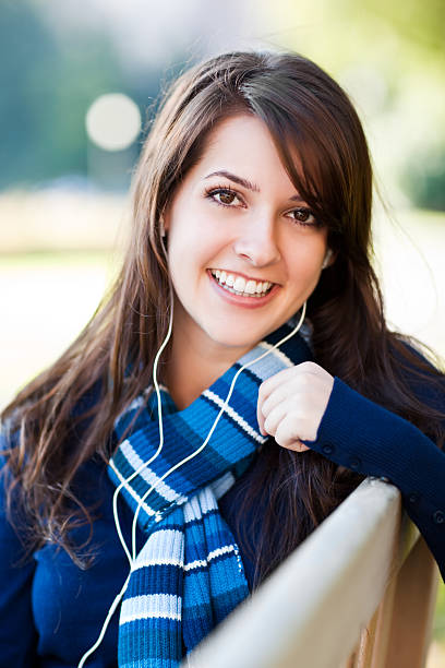 istock Mixed race college student listening to music 153736713