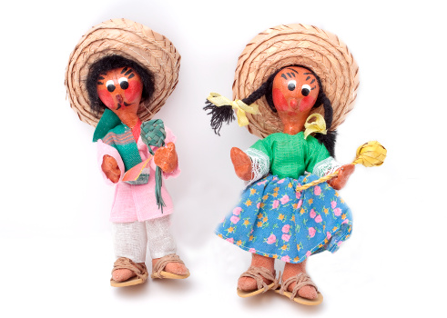 Two mariachi dolls isolated on a white background