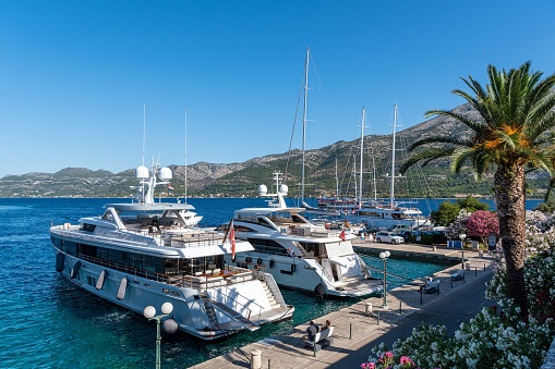 Monte Carlo, Monaco - 1st August, 2014: Super-luxury yachts in a harbor. These yachts are available for charter.
