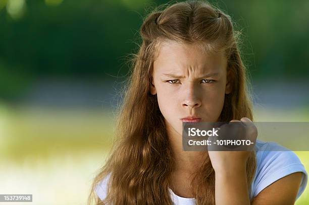 Severe Teenage Girl Shakes Her Fist Stock Photo - Download Image Now - Adult, Cute, Females