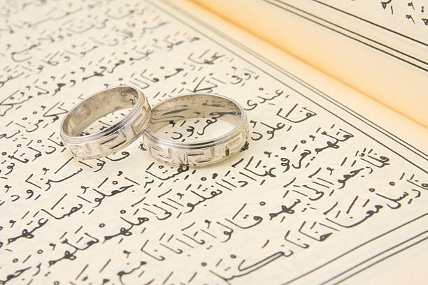 wedding rings on Qur'an religious wedding rings koran photos stock pictures, royalty-free photos & images