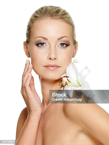 Beauty Face Of The Young Beautiful Woman With Flower Stock Photo - Download Image Now