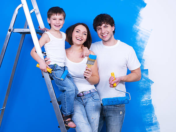 istock Smiling family with paintbrush 153740109