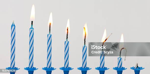 The Physical Time Line Of A Blue Candle In Burning Stages Stock Photo - Download Image Now