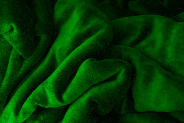 istock Green background made of fabric bent into various shapes 1537406855