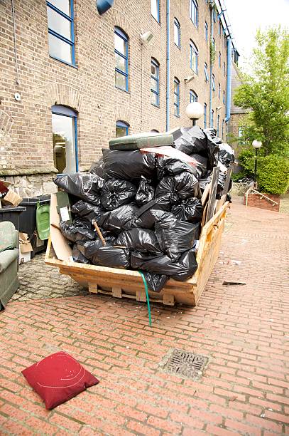 istock container rubbish black garbage plastic bags in urban street 153741111