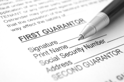 Close-up guarantee agreement form with pen