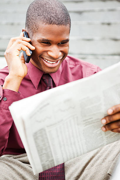 istock Businessman reading newspaper 153741878