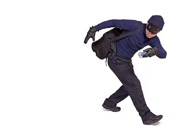 Photo of thief with hand torch