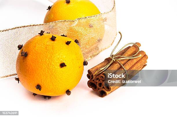 Two Clovesdecorated Ornages Cinnamon Sticks And Riboons Stock Photo - Download Image Now