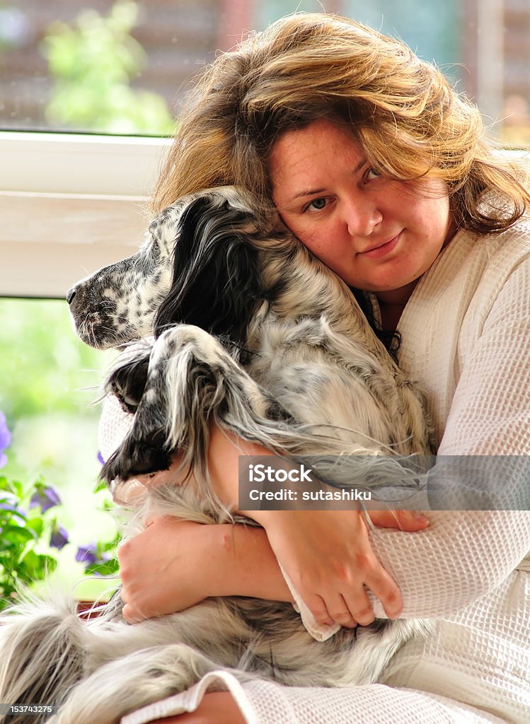 Woman with a dog woman sitting on the porch with english setter Dog Stock Photo