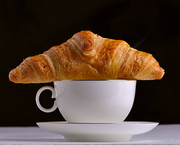 Coffee and a croissant stock photo