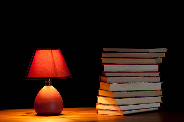 istock Lamp illuminating books 153743539