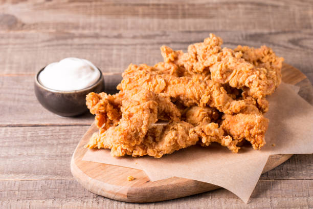 istock Crispy fried chicken breast strips with sauce 1537441351