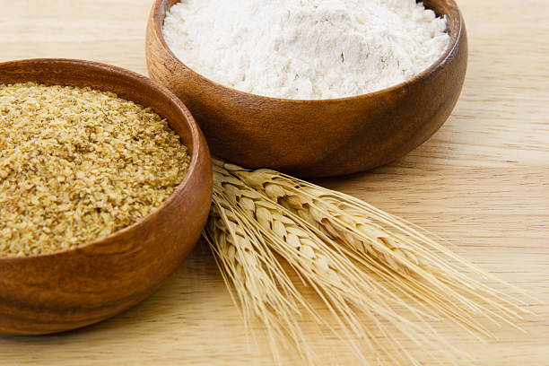dos madera y tazones con harina, germen de trigo - wheat whole wheat close up cereal plant fotografías e imágenes de stock