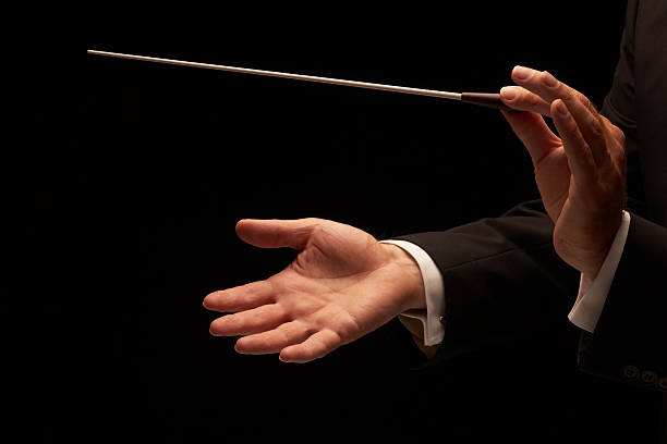 istock Conductor conducting an orchestra 153745520