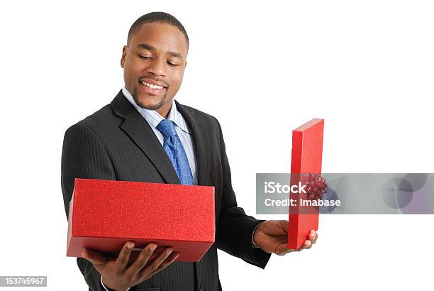 African American Business Man Opening A Christmas Gift Box Stock Photo - Download Image Now