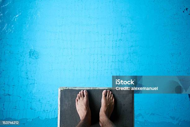 Aerial View Of Mans Feet On Diving Board On Blue Stock Photo - Download Image Now - Diving Into Water, Diving Board, Swimming Pool