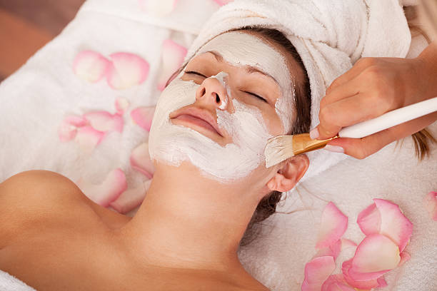 istock Young women getting facial mask 153746441