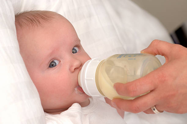 istock Mother feeding baby 153746933