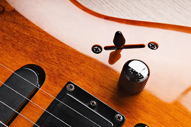 Close-up shot of a part of an electric guitar.