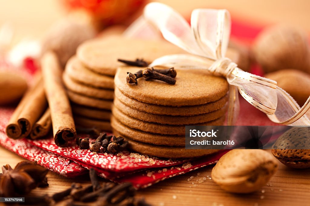 Heart-shaped gingerbread cookies gingerbread cookies tied with ribbon, nuts and spices Almond Stock Photo